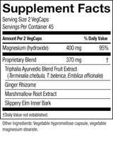 A close-up of a supplement facts label showing serving size 2 VegCaps, 45 servings per container, and a proprietary blend of Triphala Ayurvedic Blend Fruit Extract, Ginger Rhizome, Marshmallow Root Extract, and Slippery Elm Inner Bark.