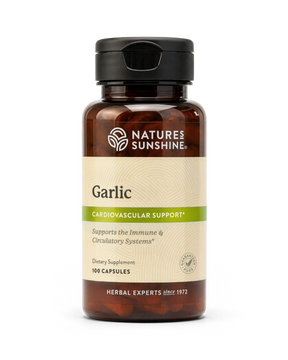 A bottle of Nature's Sunshine Capsicum dietary supplement, featuring an amber brown bottle, a black flip-top cap, and a cream-colored label with green accents.