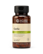 A bottle of Nature's Sunshine Capsicum dietary supplement, featuring an amber brown bottle, a black flip-top cap, and a cream-colored label with green accents.