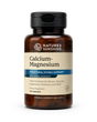 A bottle of Nature's Sunshine Calcium-Magnesium dietary supplement with herbal extracts, featuring an amber brown bottle, black cap, and a beige label with blue accents.