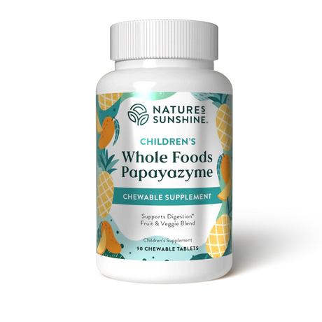 A white plastic bottle of Nature's Sunshine Children's Whole Foods Papayazyme chewable supplement, featuring a colorful label with illustrations of pineapples and mangoes on a white background.
