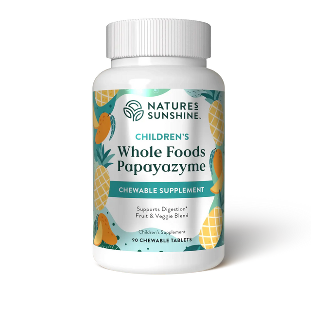 A white plastic bottle of Nature's Sunshine Children's Whole Foods Papayazyme chewable supplement, featuring a colorful label with illustrations of pineapples and mangoes on a white background.