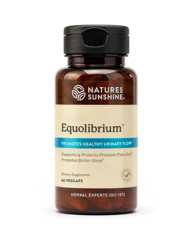 A bottle of Nature's Sunshine Equilibrium dietary supplement, featuring an amber brown bottle, a black cap, and a beige label with blue accents, set against a plain white background.