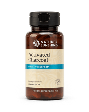 A bottle of Nature's Sunshine Activated Charcoal dietary supplement, 120 capsules, on a clean white background.