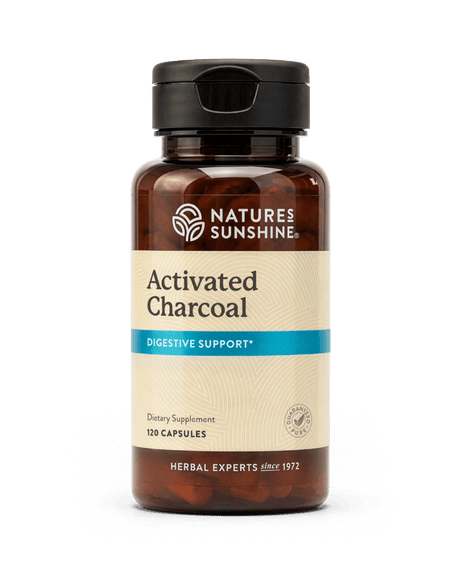 A bottle of Nature's Sunshine Activated Charcoal dietary supplement, 120 capsules, on a clean white background.