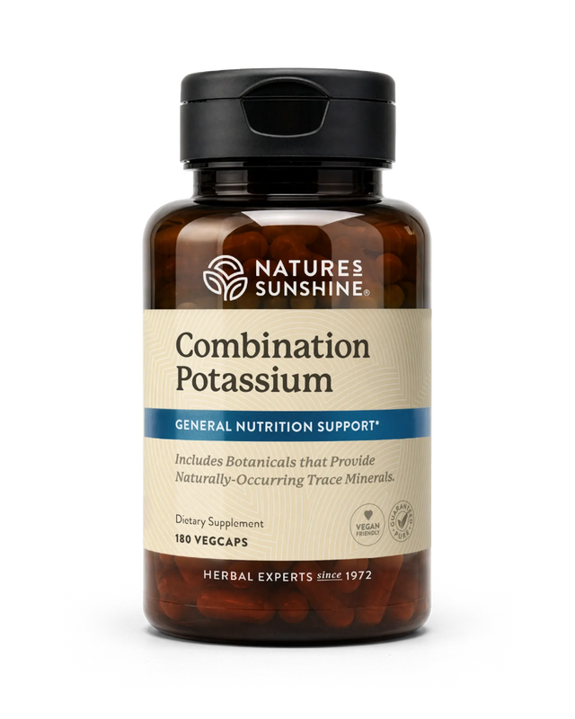 A bottle of Nature's Sunshine Combination Potassium dietary supplement, featuring an amber brown bottle, black cap, and a beige label with blue accents, containing 180 vegcaps.