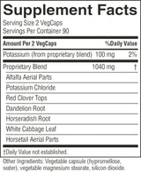 A close-up of a supplement facts label showing the 'Supplement Facts' panel for VegCaps. The label lists potassium from a proprietary blend at 100 mg per 2 VegCaps, with additional ingredients including alfalfa aerial parts, potassium chloride, red clover tops, dandelion root, horseradish root, white cabbage leaf, and horsetail aerial parts.