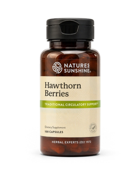A bottle of Nature's Sunshine Hawthorn Berries dietary supplement, featuring an amber brown bottle, black cap, and a beige label with green accents, set against a plain white background.