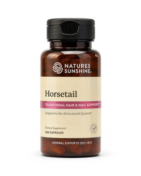 A bottle of Natures Sunshine Horsetail dietary supplement with a black cap and amber-brown bottle, on a white background.