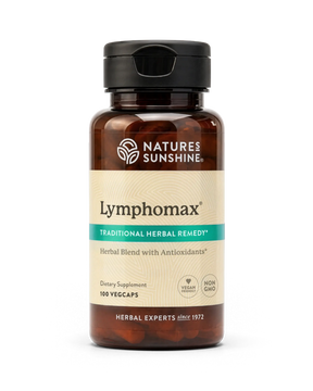 A bottle of Natures Sunshine Lymphomax herbal supplement with a black cap and a beige label, shown on a clean white background.