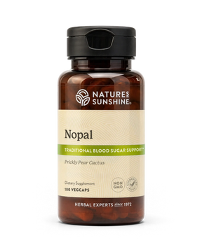 A bottle of Nature's Sunshine Hops dietary supplement with a black cap and amber-brown bottle, featuring a beige label with green accents, on a white background.