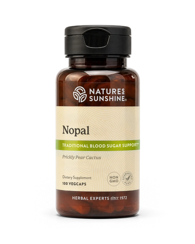 A bottle of Nature's Sunshine Hops dietary supplement with a black cap and amber-brown bottle, featuring a beige label with green accents, on a white background.