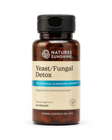A bottle of Natures Sunshine Yeast/Fungal Detox dietary supplement with amber brown plastic and a black flip-top cap, shown on a plain white background.