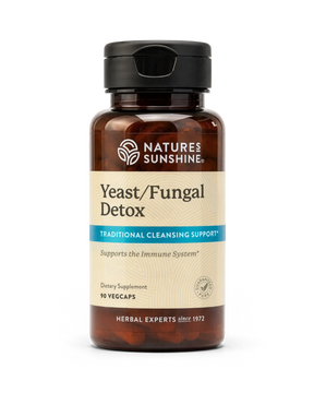 A bottle of Natures Sunshine Yeast/Fungal Detox dietary supplement with amber brown plastic and a black flip-top cap, shown on a plain white background.