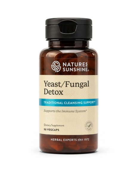 A bottle of Natures Sunshine Yeast/Fungal Detox dietary supplement with amber brown plastic and a black flip-top cap, shown on a plain white background.