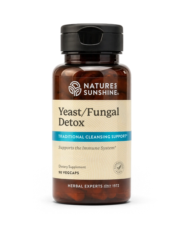 A bottle of Natures Sunshine Yeast/Fungal Detox dietary supplement with amber brown plastic and a black flip-top cap, shown on a plain white background.