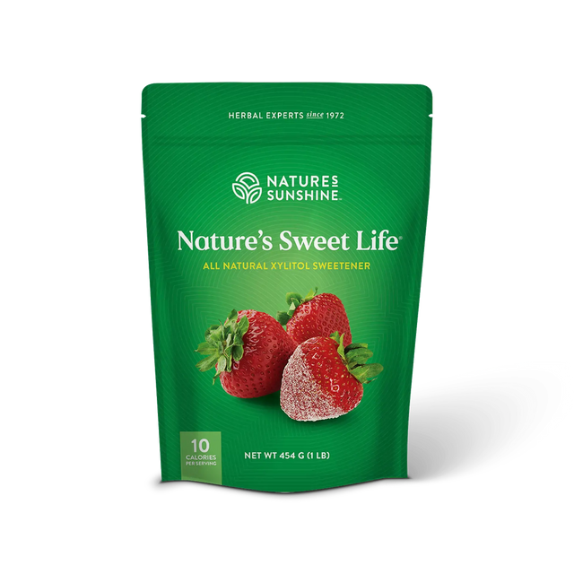 A green stand-up pouch of Nature's Sweet Life herbal xylitol sweetener by Nature's Sunshine, featuring an illustration of three strawberries on the front, set against a plain white background.