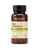 A bottle of Nature's Sunshine Red Raspberry dietary supplement with a black cap and amber-brown bottle, on a clean white background.