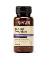 A bottle of Nature's Sunshine Bacillus Coagulans dietary supplement, featuring an amber brown bottle, a black cap, and a beige label with purple accents, set against a plain white background.