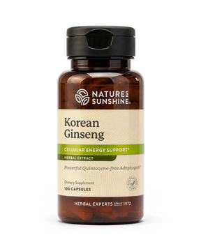 A bottle of Natures Sunshine Korean Ginseng dietary supplement, featuring an amber glass bottle with a black cap and a cream-colored label with green accents.