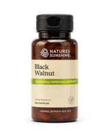 A bottle of Nature's Sunshine Black Walnut dietary supplement capsules, featuring an amber brown bottle, black cap, and a beige label with green accents.