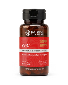 A bottle of Natures Sunshine VS-C Traditional Chinese Medicine dietary supplement, featuring a dark amber brown bottle, a black cap, and a red label with white and gold text, set against a plain white background.