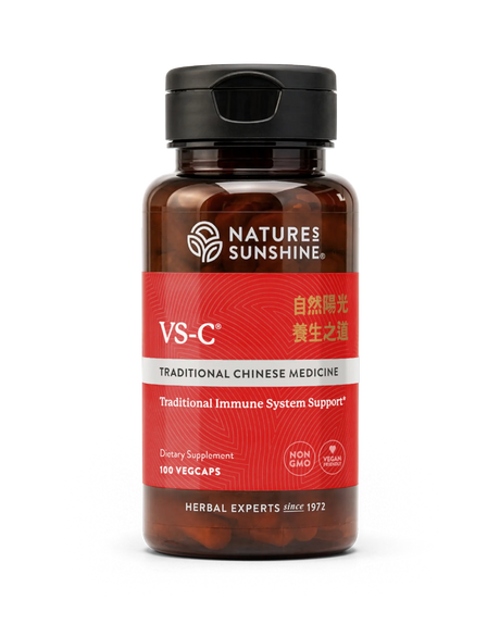 A bottle of Natures Sunshine VS-C Traditional Chinese Medicine dietary supplement, featuring a dark amber brown bottle, a black cap, and a red label with white and gold text, set against a plain white background.