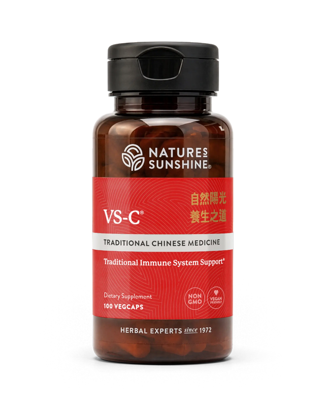 A bottle of Natures Sunshine VS-C Traditional Chinese Medicine dietary supplement, featuring a dark amber brown bottle, a black cap, and a red label with white and gold text, set against a plain white background.