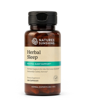 A bottle of Nature's Sunshine Herbal Sleep dietary supplement with a black cap and amber brown bottle, on a white background.