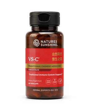A bottle of Natures Sunshine VS-C Traditional Chinese Medicine dietary supplement, featuring a dark amber brown bottle, a black flip-top cap, and a red label with gold and white text.