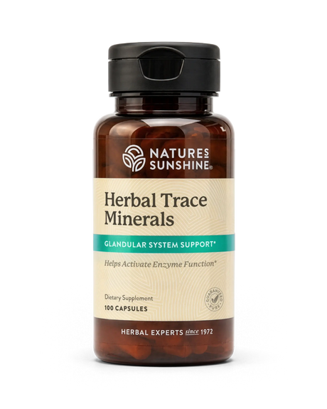 A bottle of Nature's Sunshine Herbal Trace Minerals dietary supplement, containing 100 capsules, on a clean white background.