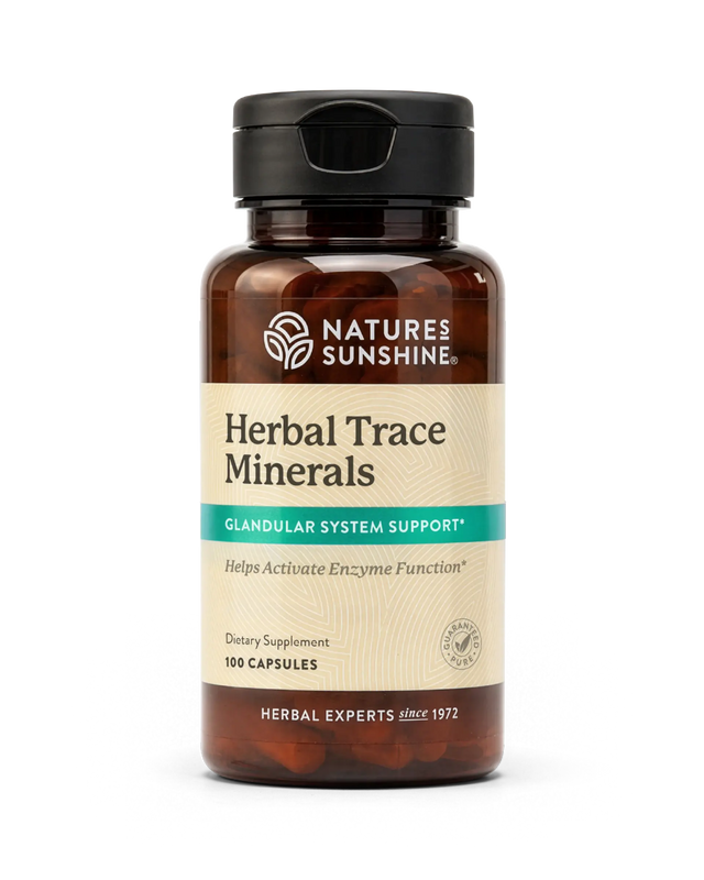 A bottle of Nature's Sunshine Herbal Trace Minerals dietary supplement, containing 100 capsules, on a clean white background.