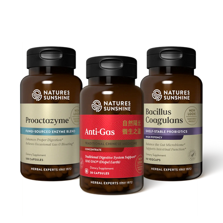 Three amber supplement bottles from Nature's Sunshine on a white background: Proactzyme on the left, Anti-Gas in the center with a red label, and Bacillus Coagulans on the right.