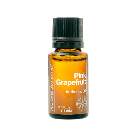 A 15 mL amber glass bottle of Natures Sunshine Pink Grapefruit Essential Oil with a black ribbed cap, shown on a solid white background.