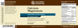 Natures Sunshine Calcium-Magnesium supplement label showing product details, supplement facts, and usage instructions on a brown background.
