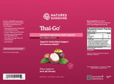 The back of a Nature's Sunshine Thai-Go dietary supplement bottle, featuring a deep magenta-pink background with white text, a product illustration of mangoes and green leaves, and a Supplement Facts panel on the right.